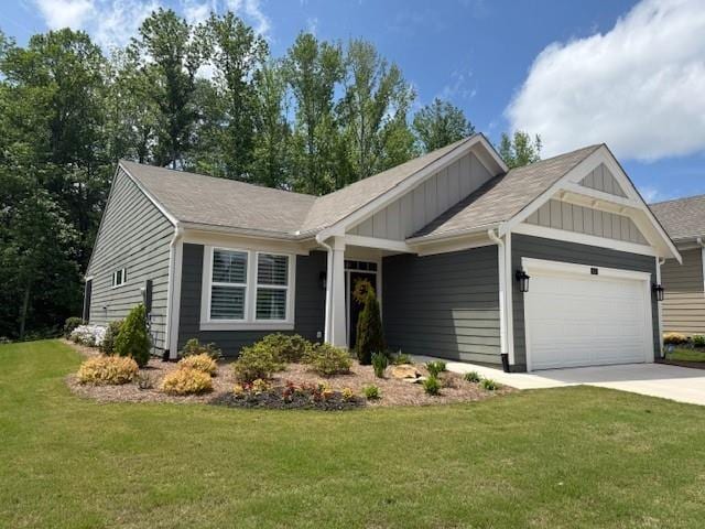 63 Aspen Way, Dallas, GA 30157 - view of front of home with board and batten siding, a garage, driveway, and a front lawn