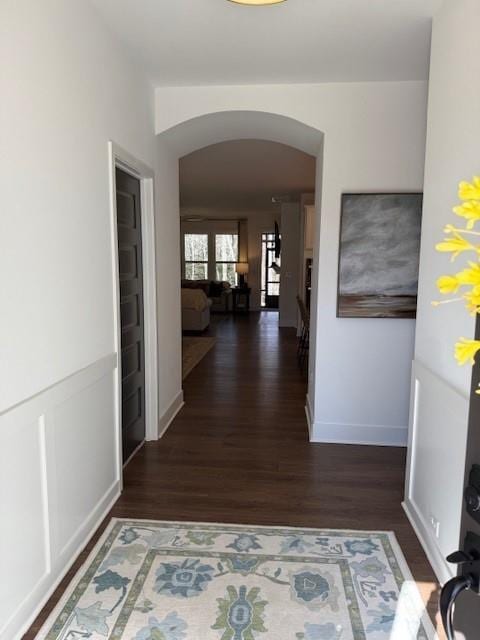 63 Aspen Way, Dallas, GA 30157 - hall with arched walkways, wood finished floors, and baseboards