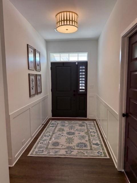 63 Aspen Way, Dallas, GA 30157 - doorway to outside featuring a decorative wall, wainscoting, and dark wood-style flooring
