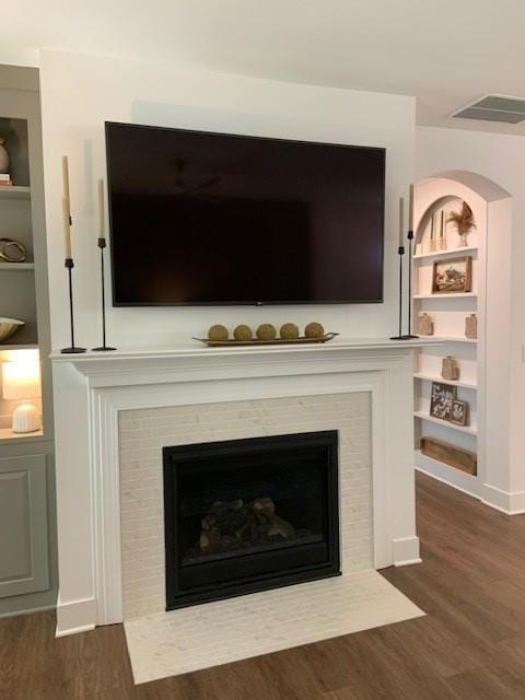 63 Aspen Way, Dallas, GA 30157 - detailed view of wood finished floors, a fireplace with flush hearth, and built in features