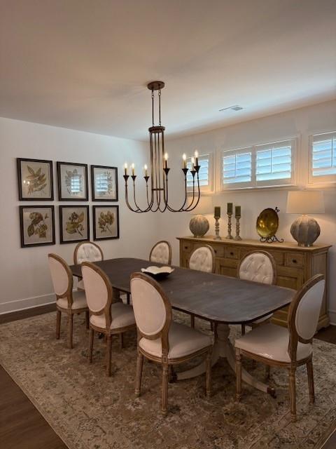 63 Aspen Way, Dallas, GA 30157 - dining room with a chandelier, wood finished floors, and baseboards