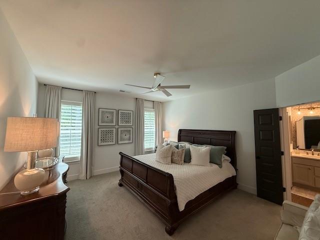 63 Aspen Way, Dallas, GA 30157 - bedroom featuring multiple windows, light carpet, and baseboards