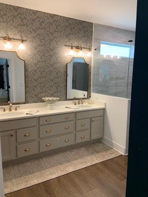 63 Aspen Way, Dallas, GA 30157 - bathroom with wood finished floors, double vanity, wallpapered walls, and walk in shower
