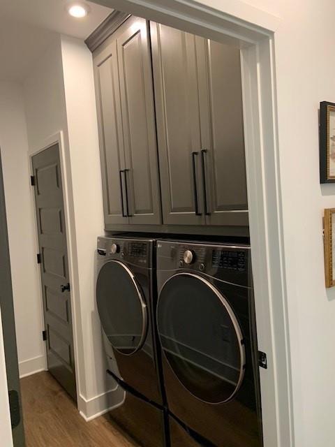 63 Aspen Way, Dallas, GA 30157 - washroom with washing machine and clothes dryer, baseboards, wood finished floors, cabinet space, and recessed lighting