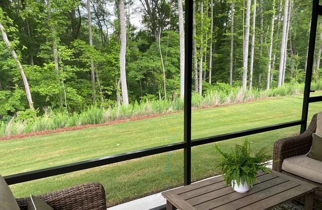 63 Aspen Way, Dallas, GA 30157 - sunroom with a wooded view