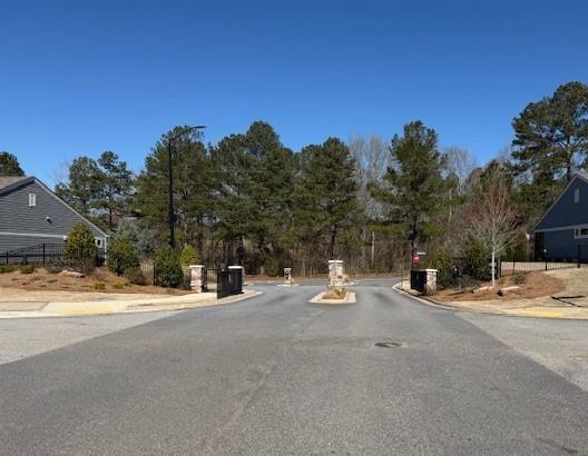63 Aspen Way, Dallas, GA 30157 - view of asphalt road featuring curbs and street lights