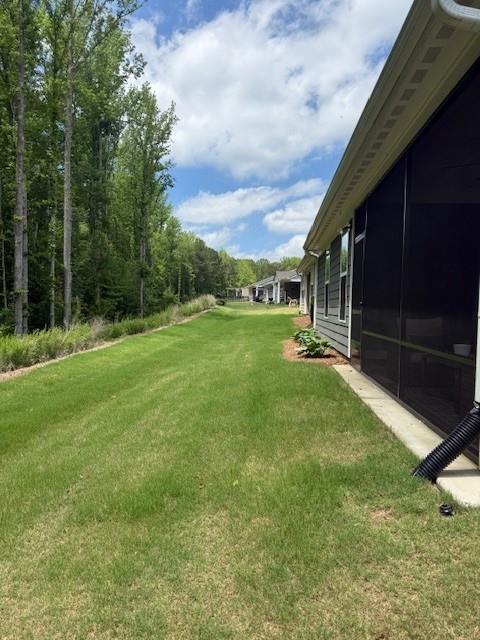 63 Aspen Way, Dallas, GA 30157 - view of green lawn with a sunroom