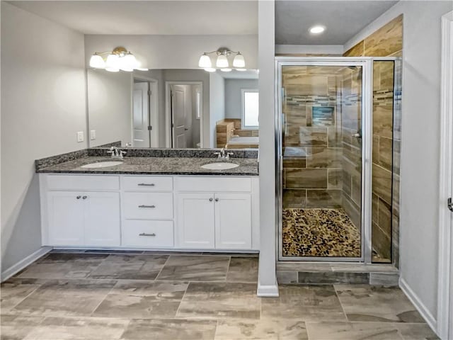 bathroom with an enclosed shower and vanity