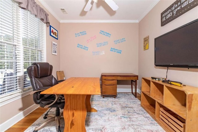 office space featuring ceiling fan, ornamental molding, and light hardwood / wood-style floors