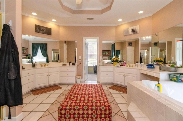 bathroom with crown molding, tile patterned floors, a raised ceiling, and vanity