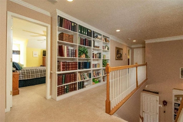 hallway with carpet and ornamental molding