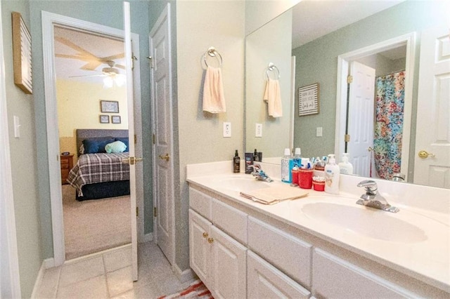 bathroom with ceiling fan, vanity, and tile patterned flooring