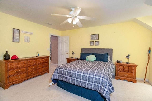 bedroom with ceiling fan and light colored carpet