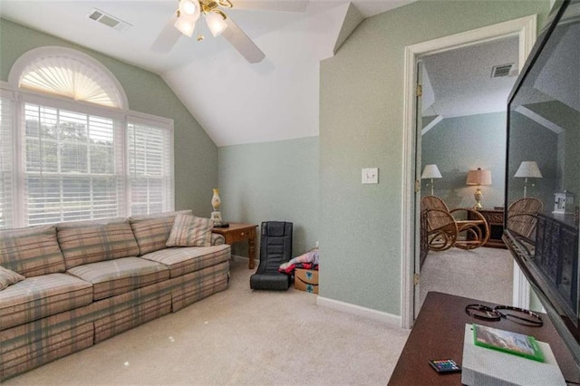 carpeted living room featuring ceiling fan and vaulted ceiling