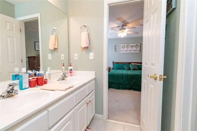 bathroom featuring ceiling fan, tile patterned floors, and vanity