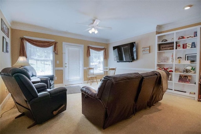 living room with light carpet, ceiling fan, and ornamental molding