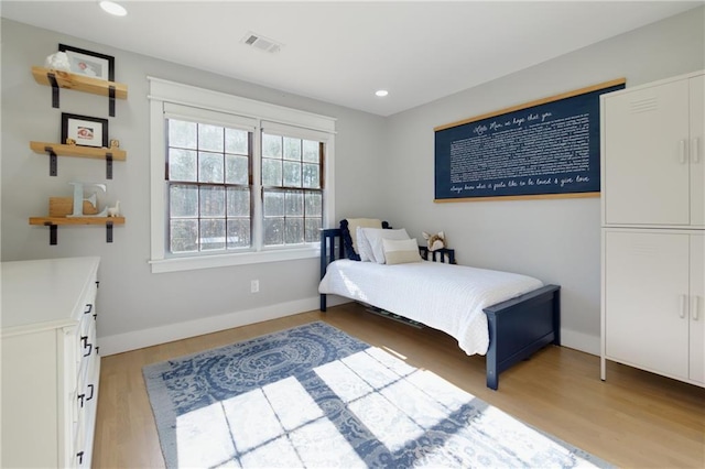 bedroom with recessed lighting, baseboards, visible vents, and light wood finished floors