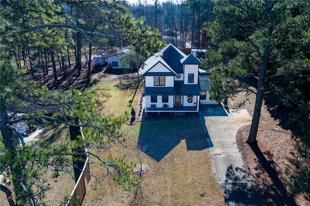 exterior space with concrete driveway and fence