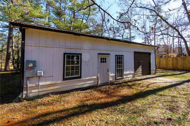 exterior space with a garage and fence