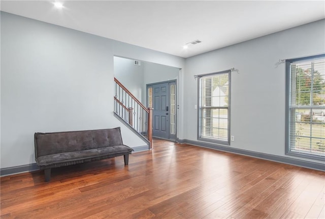 foyer entrance featuring hardwood / wood-style flooring and a wealth of natural light