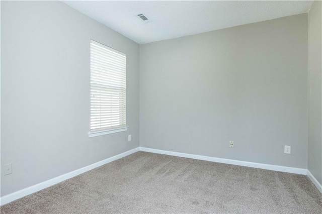 2384 Coach Way, Jonesboro, GA 30236 - unfurnished room with baseboards, visible vents, and carpet flooring