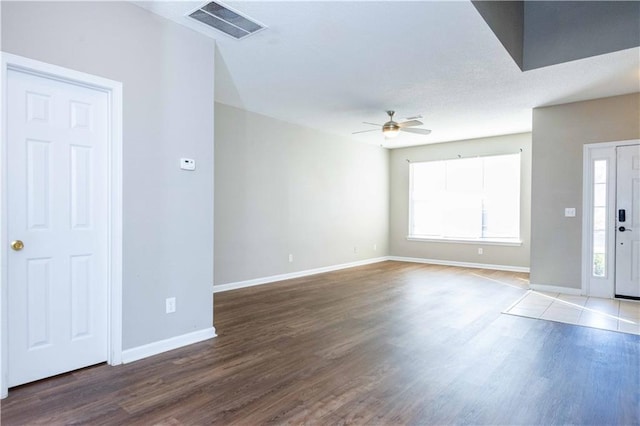 2384 Coach Way, Jonesboro, GA 30236 - unfurnished living room featuring visible vents, ceiling fan, wood finished floors, and baseboards