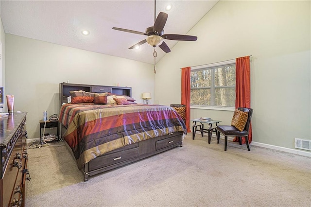 bedroom featuring ceiling fan, lofted ceiling, and light carpet