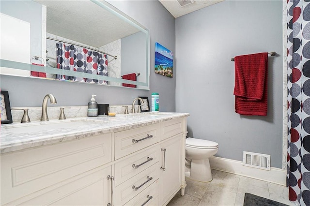 bathroom featuring vanity, curtained shower, and toilet