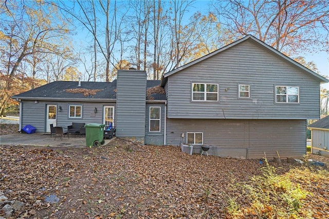 rear view of property featuring a patio area