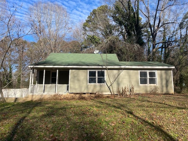 exterior space featuring a porch and a front yard