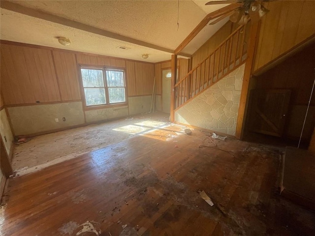 interior space with ceiling fan and vaulted ceiling