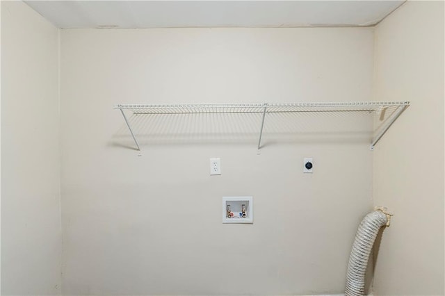 clothes washing area featuring electric dryer hookup, washer hookup, and laundry area