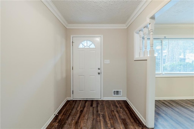 entrance foyer featuring plenty of natural light, a textured ceiling, and baseboards