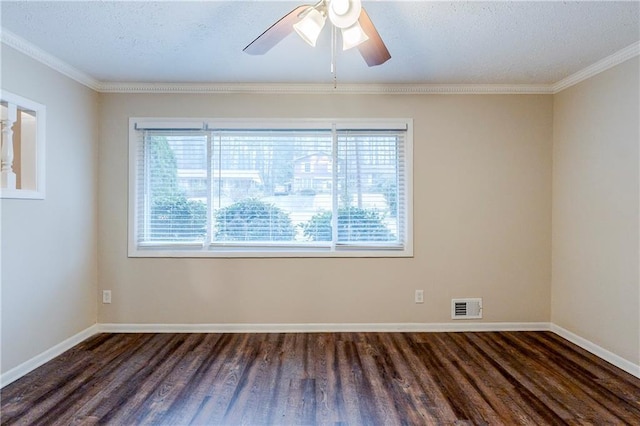 empty room with visible vents, baseboards, ceiling fan, and wood finished floors