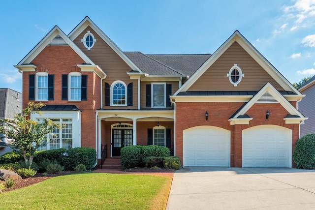 view of front of property with a garage and a front lawn