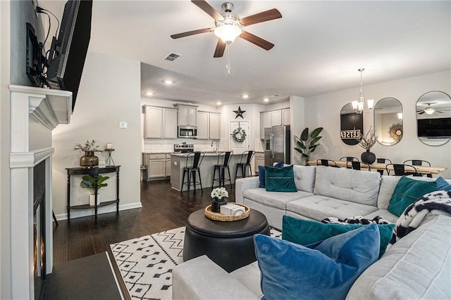 7086 Gladstone Cir, Lithonia, GA 30038 - living room with a ceiling fan, a fireplace, dark wood-style flooring, and recessed lighting
