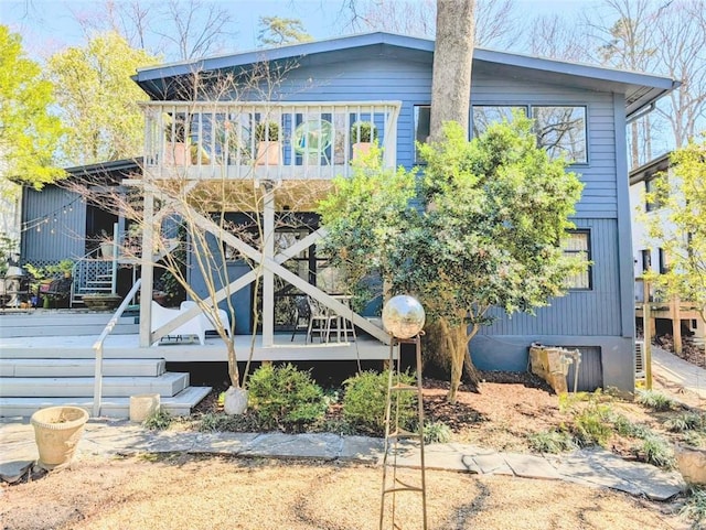 rear view of house with a deck