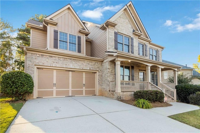 view of front of house with a porch and a garage