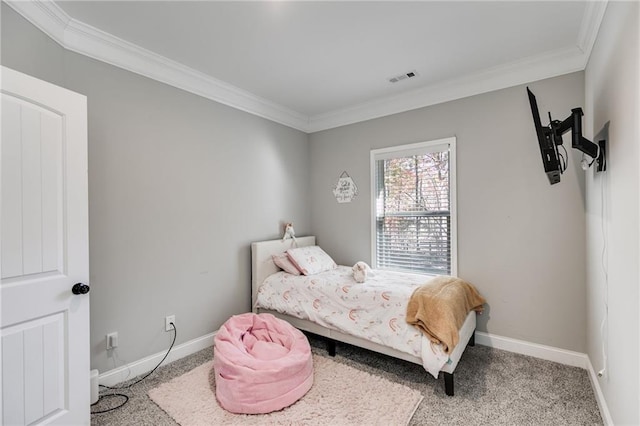 carpeted bedroom with ornamental molding