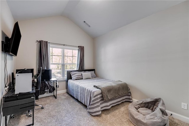 bedroom with vaulted ceiling and light carpet