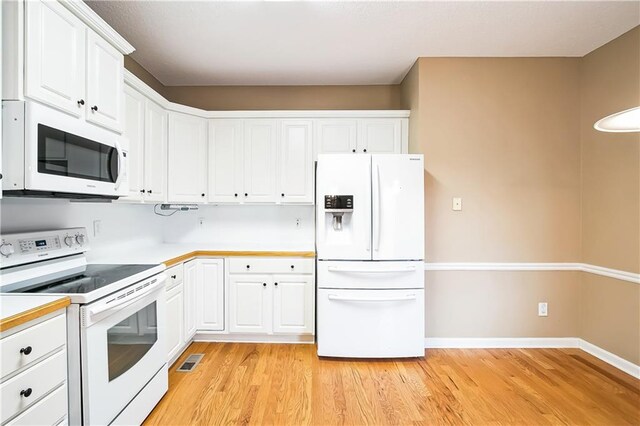 1008 Walnut Creek Dr, Woodstock, GA 30188 - kitchen with visible vents, white appliances, light countertops, white cabinetry, and light wood finished floors