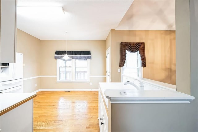 1008 Walnut Creek Dr, Woodstock, GA 30188 - laundry room featuring baseboards and light wood finished floors