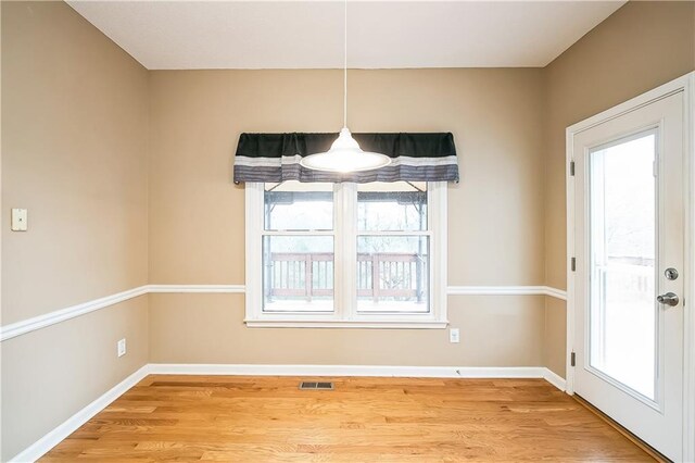 1008 Walnut Creek Dr, Woodstock, GA 30188 - unfurnished dining area with visible vents, a wealth of natural light, and wood finished floors