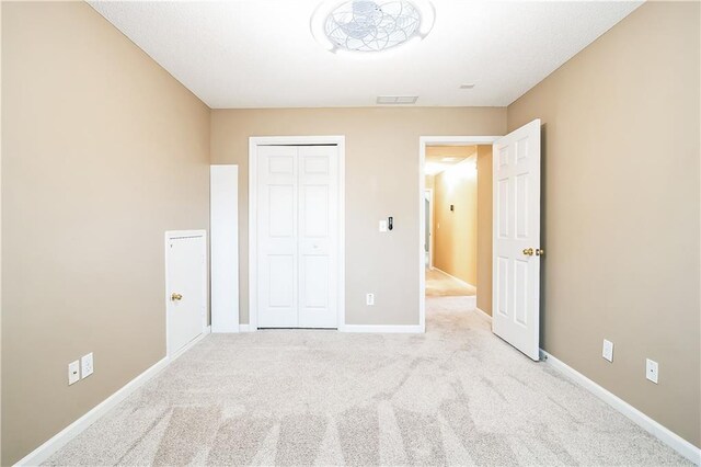 1008 Walnut Creek Dr, Woodstock, GA 30188 - unfurnished bedroom with carpet floors, baseboards, a closet, and visible vents