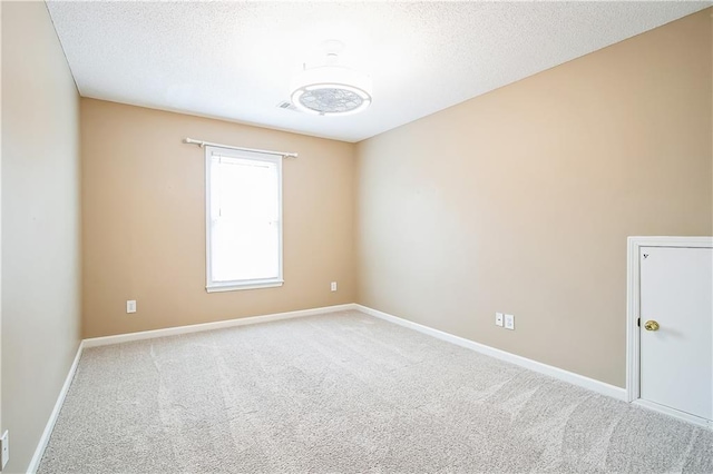 1008 Walnut Creek Dr, Woodstock, GA 30188 - carpeted empty room featuring baseboards and a textured ceiling