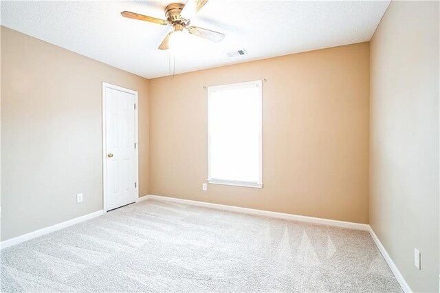 1008 Walnut Creek Dr, Woodstock, GA 30188 - carpeted empty room featuring ceiling fan, visible vents, and baseboards