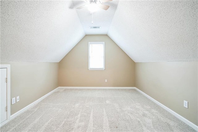 1008 Walnut Creek Dr, Woodstock, GA 30188 - additional living space with carpet floors, a ceiling fan, a textured ceiling, and visible vents