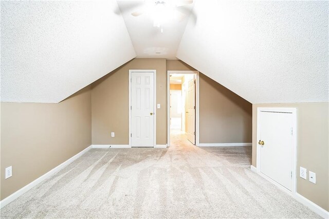 1008 Walnut Creek Dr, Woodstock, GA 30188 - additional living space featuring baseboards, carpet, a textured ceiling, and lofted ceiling