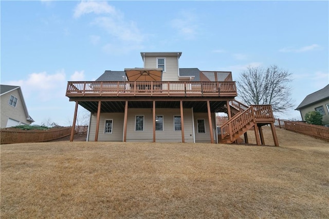 1008 Walnut Creek Dr, Woodstock, GA 30188 - back of house with fence, stairs, a wooden deck, and a lawn