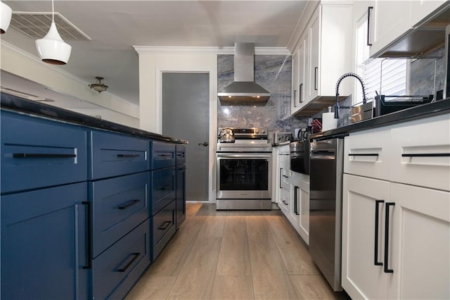 2316 Mountain Crest Pl, Gainesville, GA 30501 - kitchen with stainless steel electric range oven, wall chimney range hood, blue cabinetry, white cabinetry, and crown molding